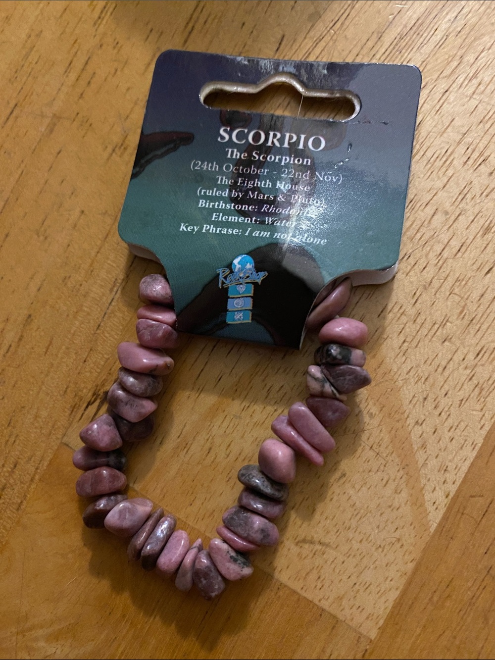 V! Scorpio zodiac stretch bracelet featuring tumbled pink rhodonite crystal chip